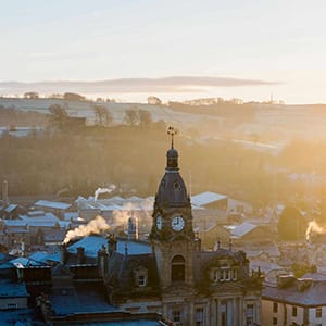View of Kendal with the town hall spire at the centre — representing the Kendal Tier for feature podcast guests on the Be a Guest page of Sukanya The Podcast.