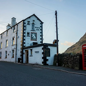 View of the White Lion Pub in the Lake District, evoking the magic of acoustic gatherings and pub sessions – representing the Lakeland Session Featured Musician of the Month on Sukanya The Podcast,
